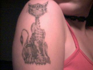 My cheshire cat tattoo upper right arm